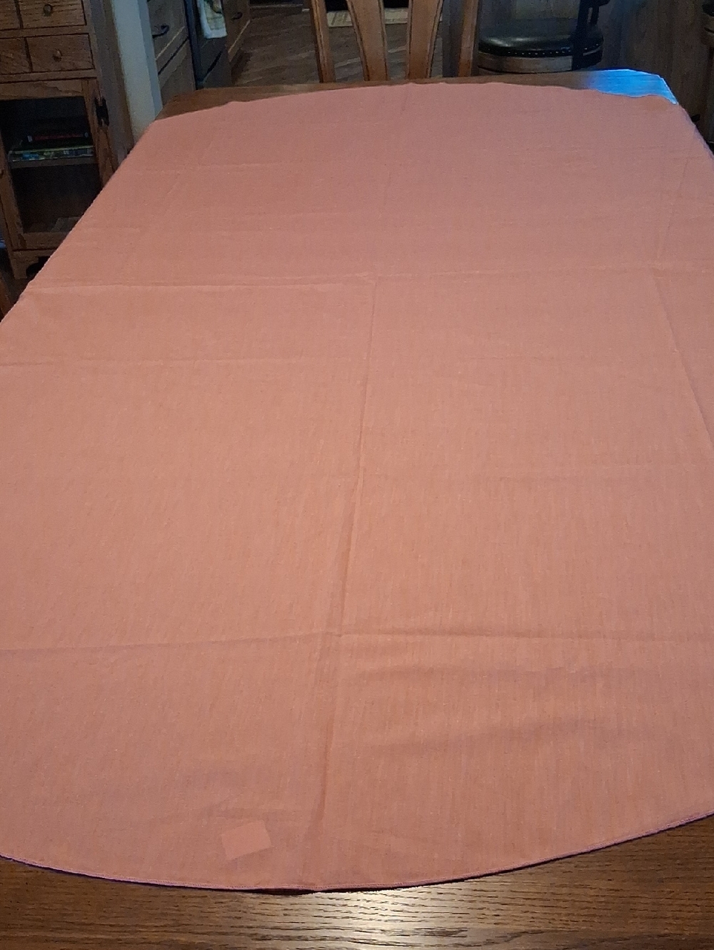 Rose pink oval tablecloth, 84" X 58".
